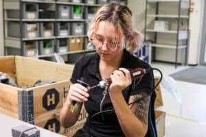 Mounting completed PCBs into enclosures for final delivery.